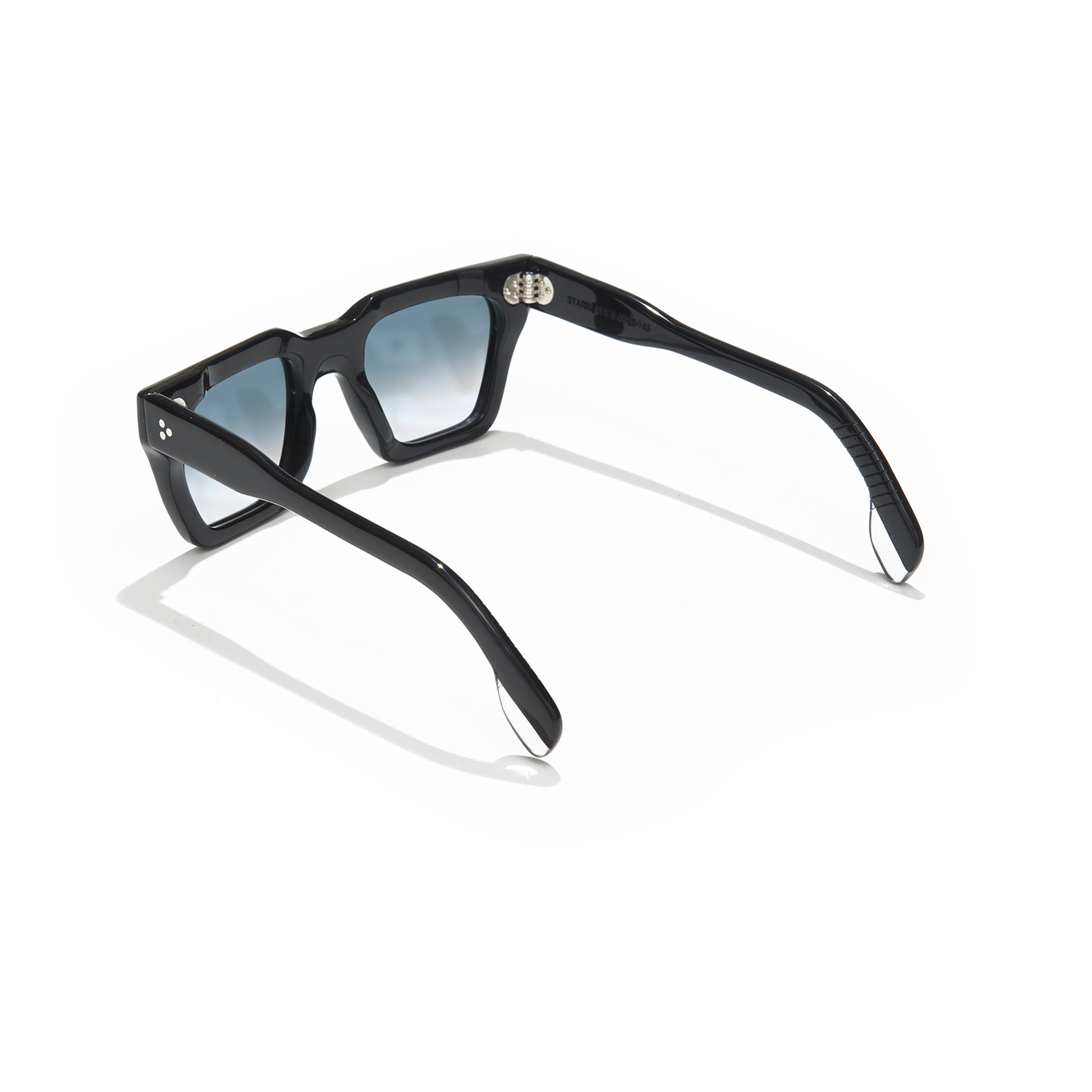 Black sunglasses with blue gradient lenses on a white background